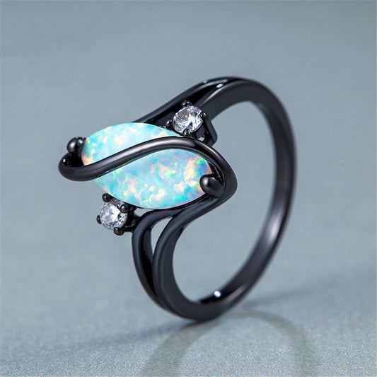 S-shaped blue black gold horse eye ring