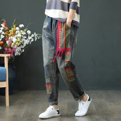Jeans with vintage embroidered buckle patch
