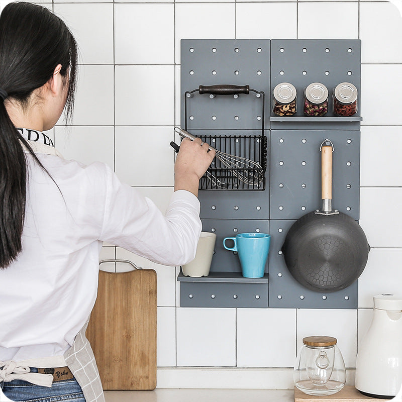Simple wall-mounted plastic hole plate storage rack