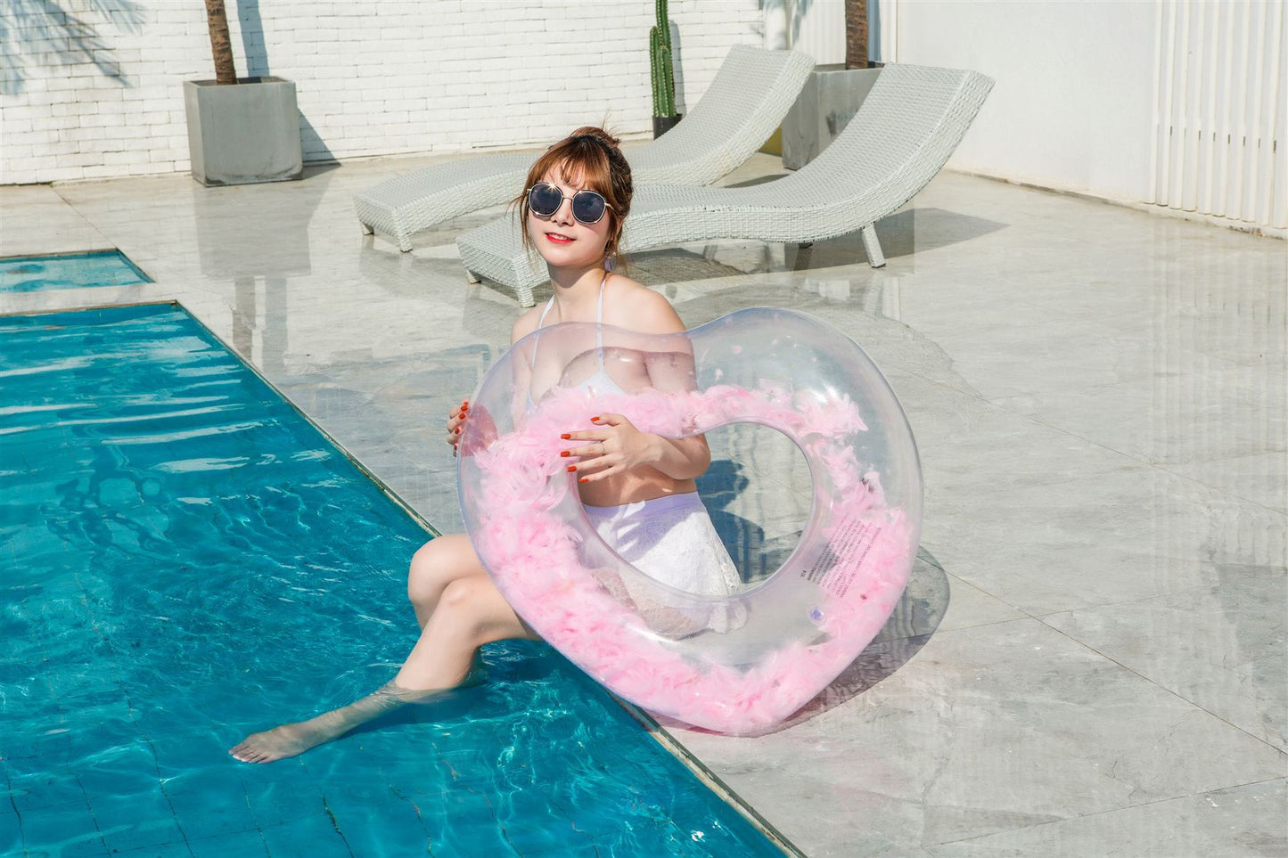 Inflatable love feather swimming ring