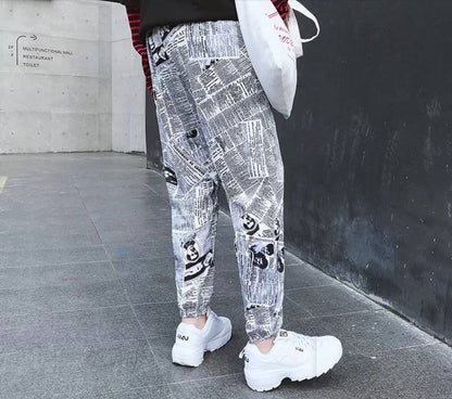 Tide brand hip hop newspaper pants men and women pants ins the same paragraph street loose beam pants national tide