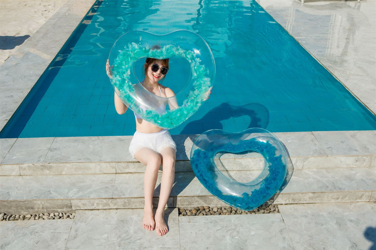 Inflatable love feather swimming ring