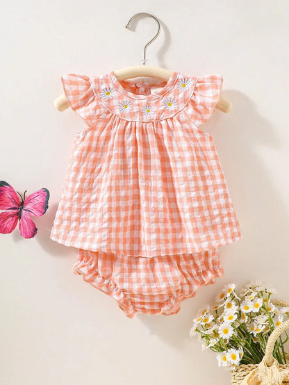 Newborn baby girl two-piece set: white cotton pleated sleeveless checkered top and matching triangular leggings