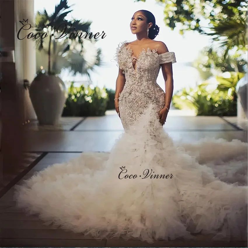 Customized Luxury Beading Mermaid Wedding Dress 2026 New Off The Shoulder Tulle Rufflus Africa Mermaid Wedding Dresses W1426