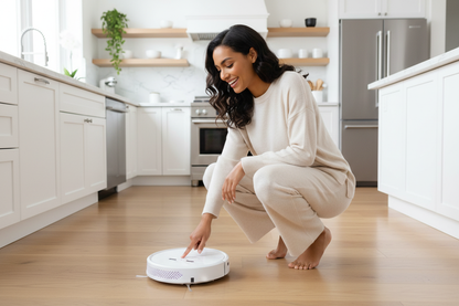 Beautiful Model Activating White Robot Vacuum in Modern Kitchen
