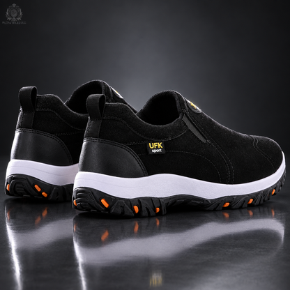 Black men’s shoes in a charcoal reflective studio