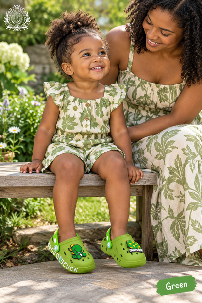 Green dinosaur clogs toddler lifestyle