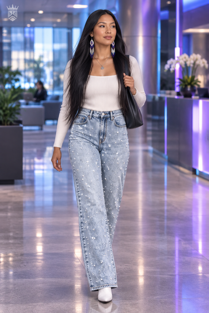 Young woman in office lobby wearing beaded jeans